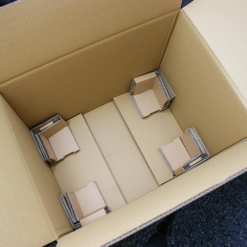 Transport-Schutzverpackung für ganze Tassenkartons 